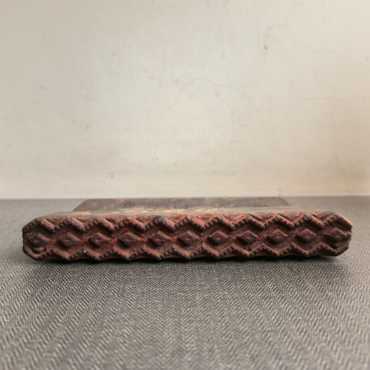 Antique geometric border printing block showing the hand-carved diamond pattern.