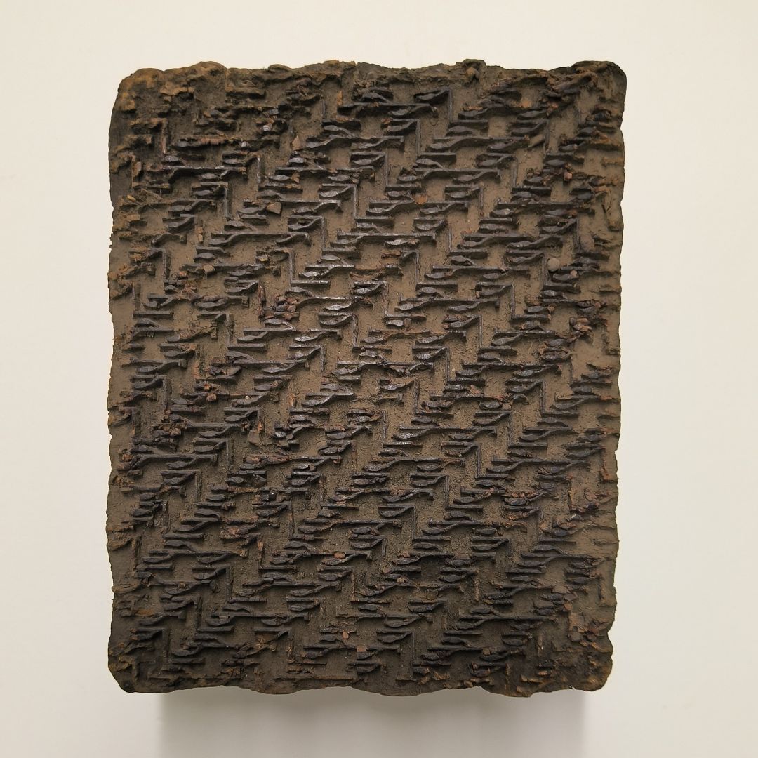 Hand-carved antique Indian wooden printing block with diagonal lattice design