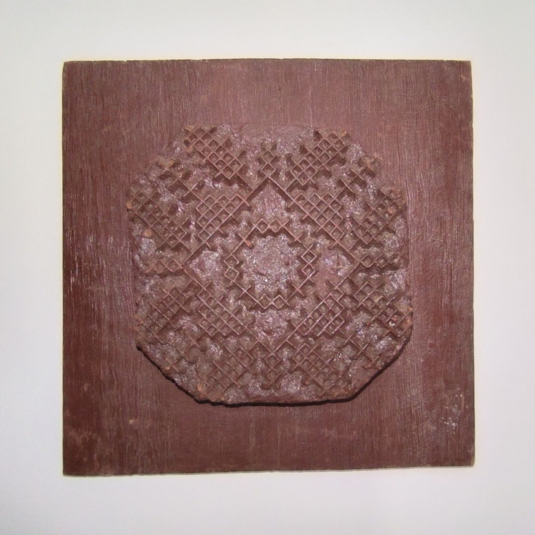 Antique Indian wooden printing block with hand-carved geometric lattice and diamond pattern mounted on wood