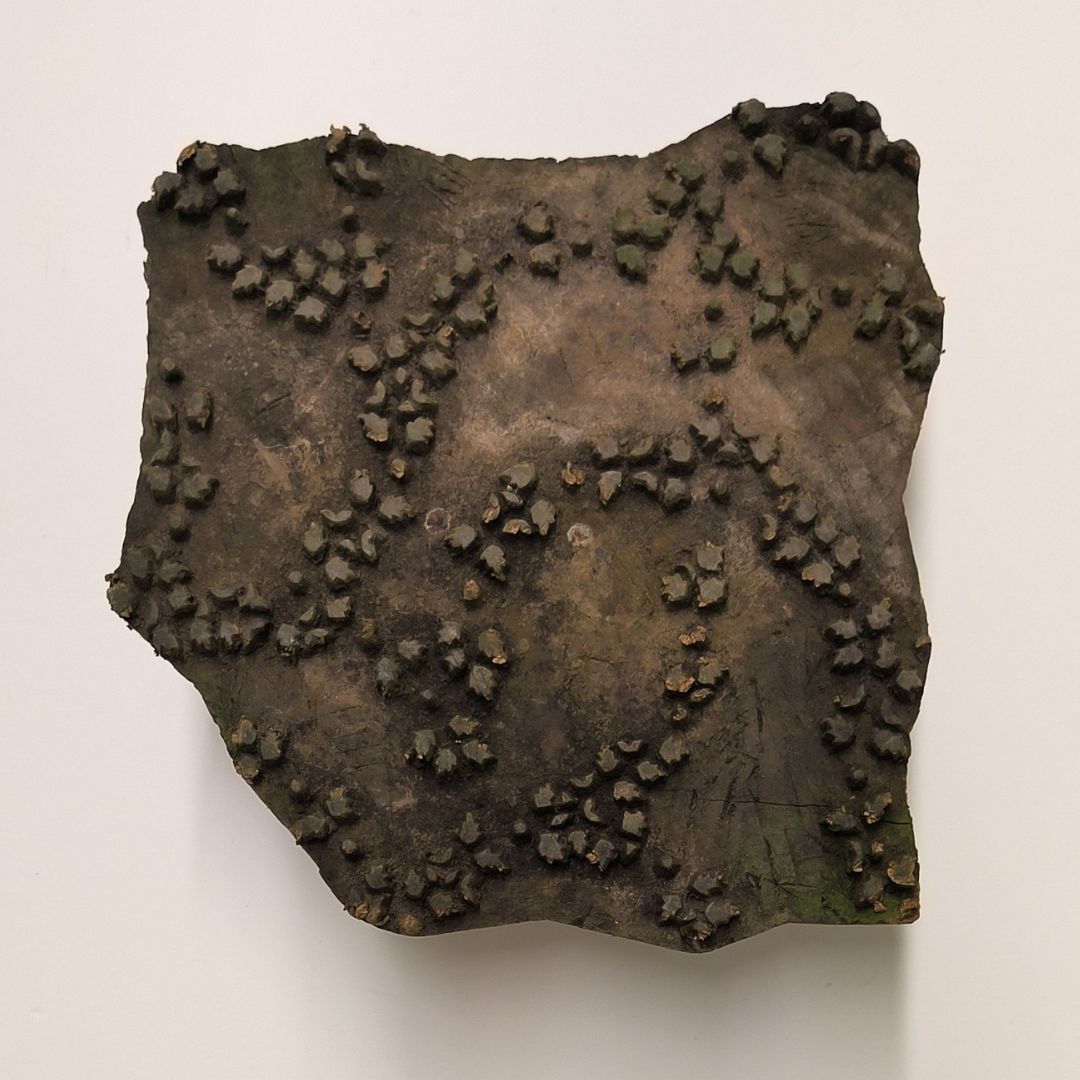 Rustic Indian printing block featuring hand-carved vine and leaf-inspired clusters