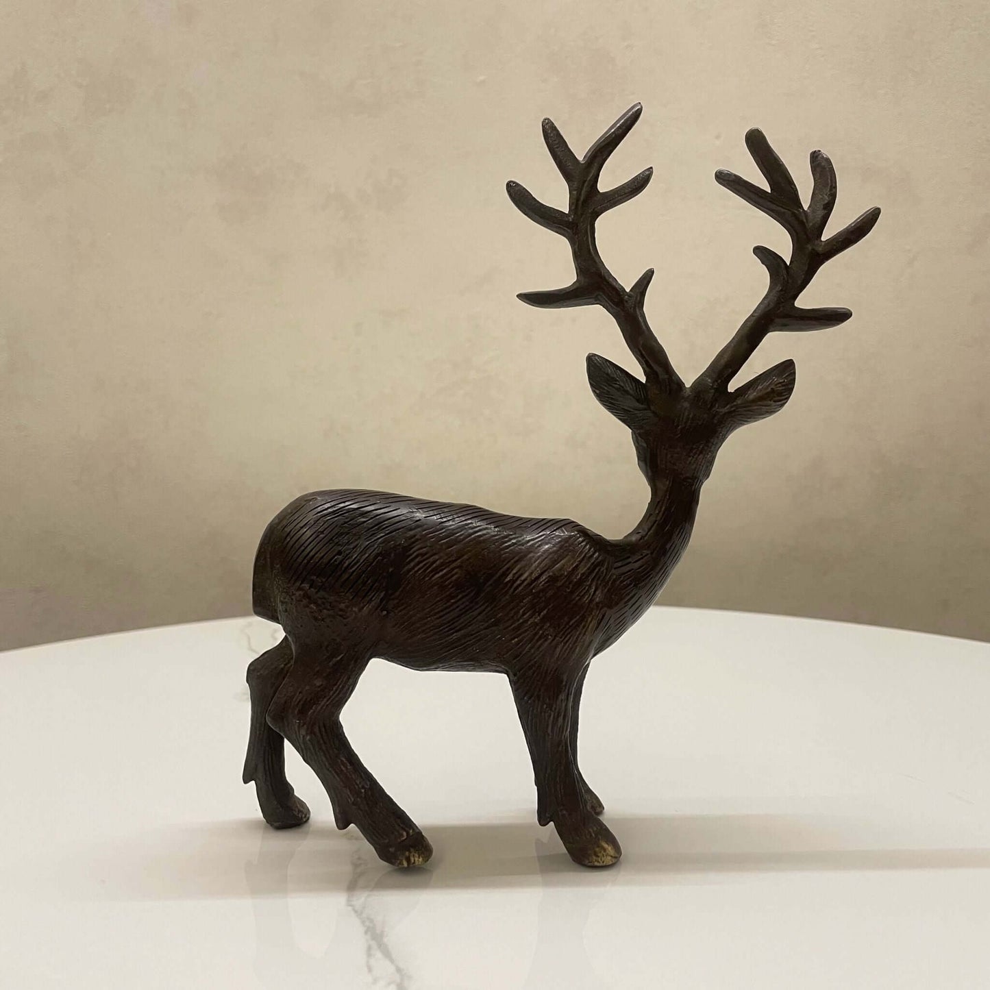 Detailed brass deer statue with antlers