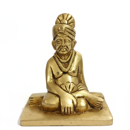 Golden brass Swami Samarth Murti idol isolated on white background