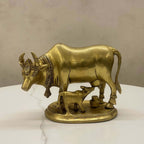 Handcrafted brass cow and calf statue (Kamadhenu idol) for Vastu and spiritual home decor.