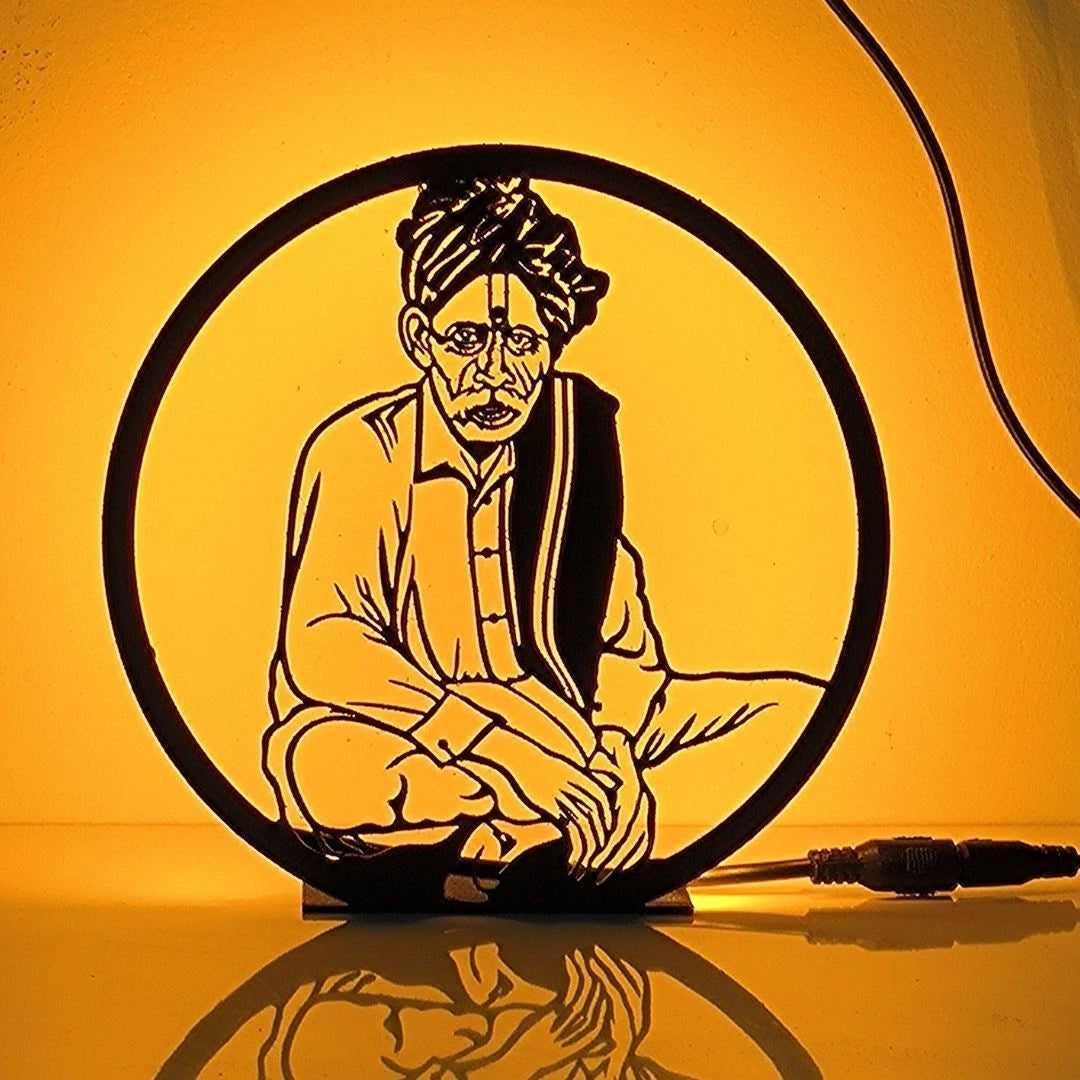 Balumama Table Lamp glowing warm LED light on table, front view