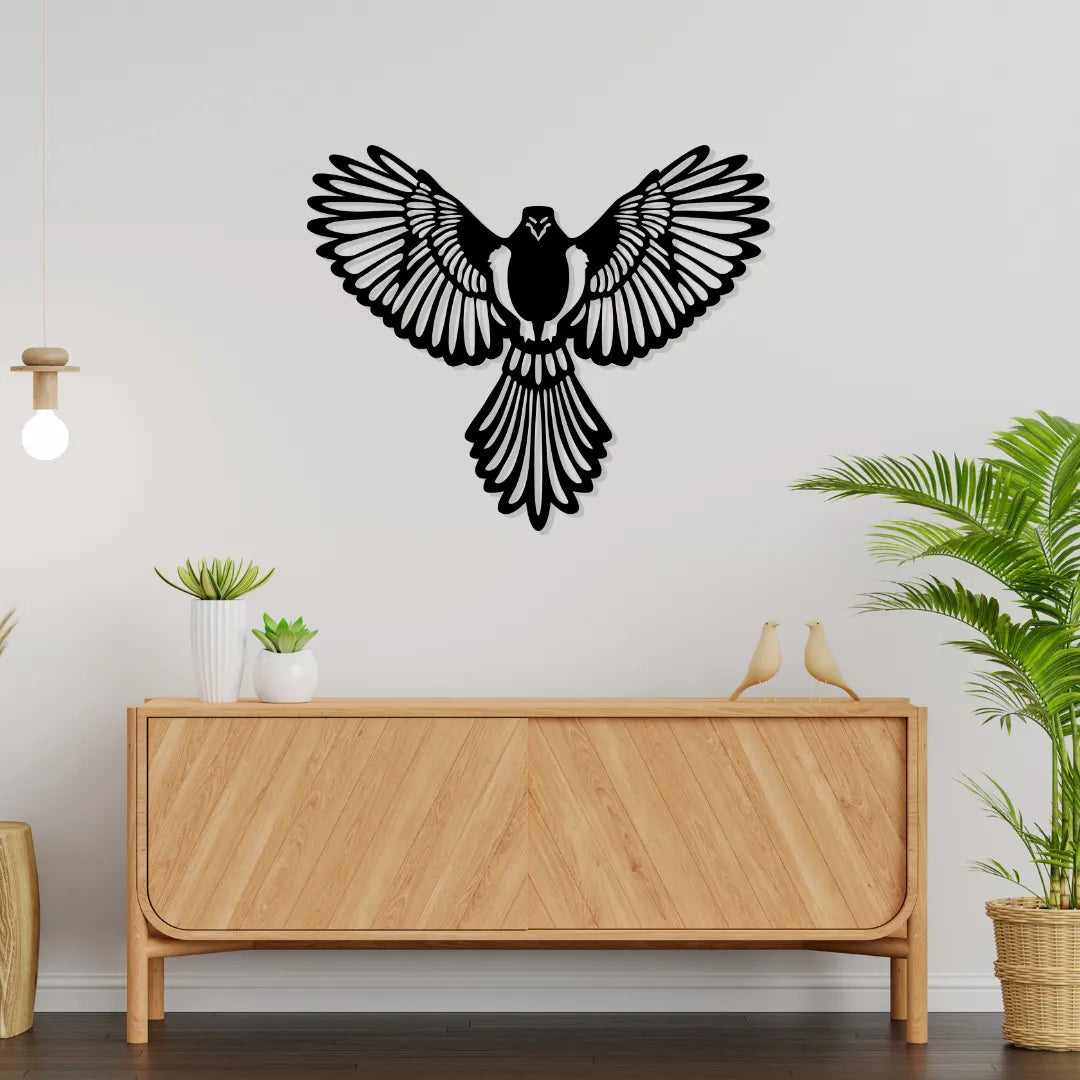 Black eagle metal wall art decor with spread wings above wooden sideboard