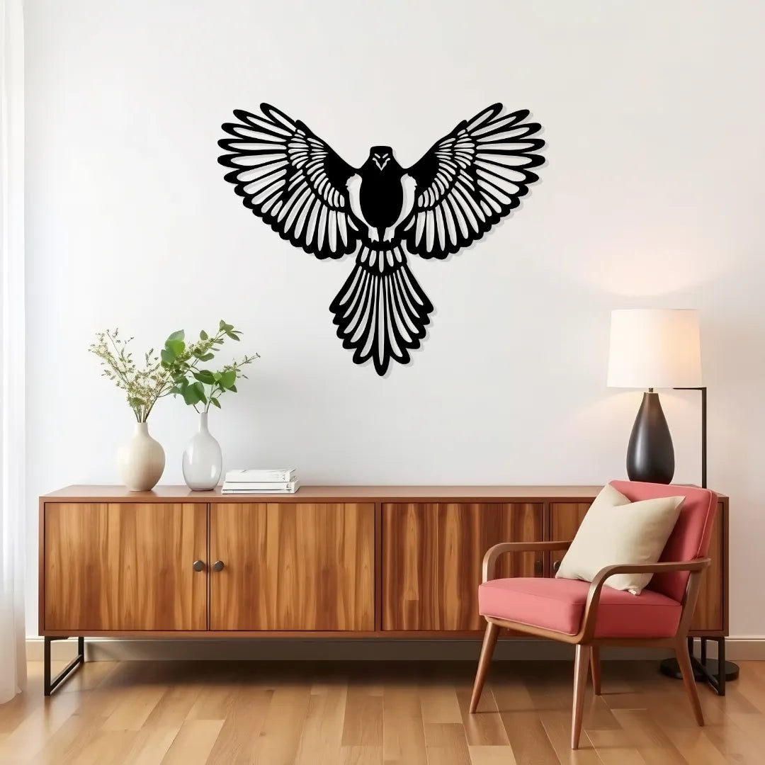 Black eagle metal wall decor displayed in modern living room above cabinet and chair