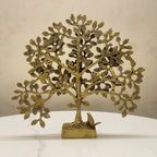 Brass Tree of Life decor idol with birds, front view on white marble surface
