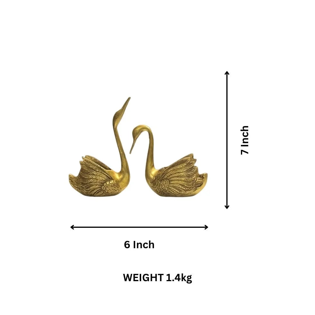 Brass swan pair decor showpiece with intricate feather detailing, angled view