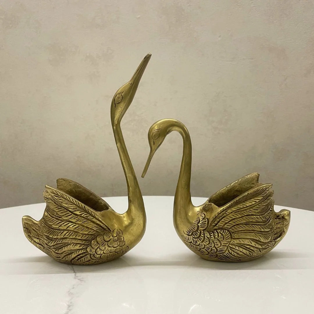 Brass swan pair showpiece with hand-polished golden finish, front view