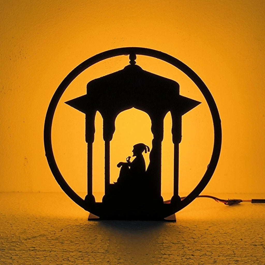 Chhatrapati Shivaji Maharaj Table Lamp glowing warm LED light on table, front view