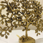 Close-up of brass Tree of Life branches and bird detailing, handcrafted finish
