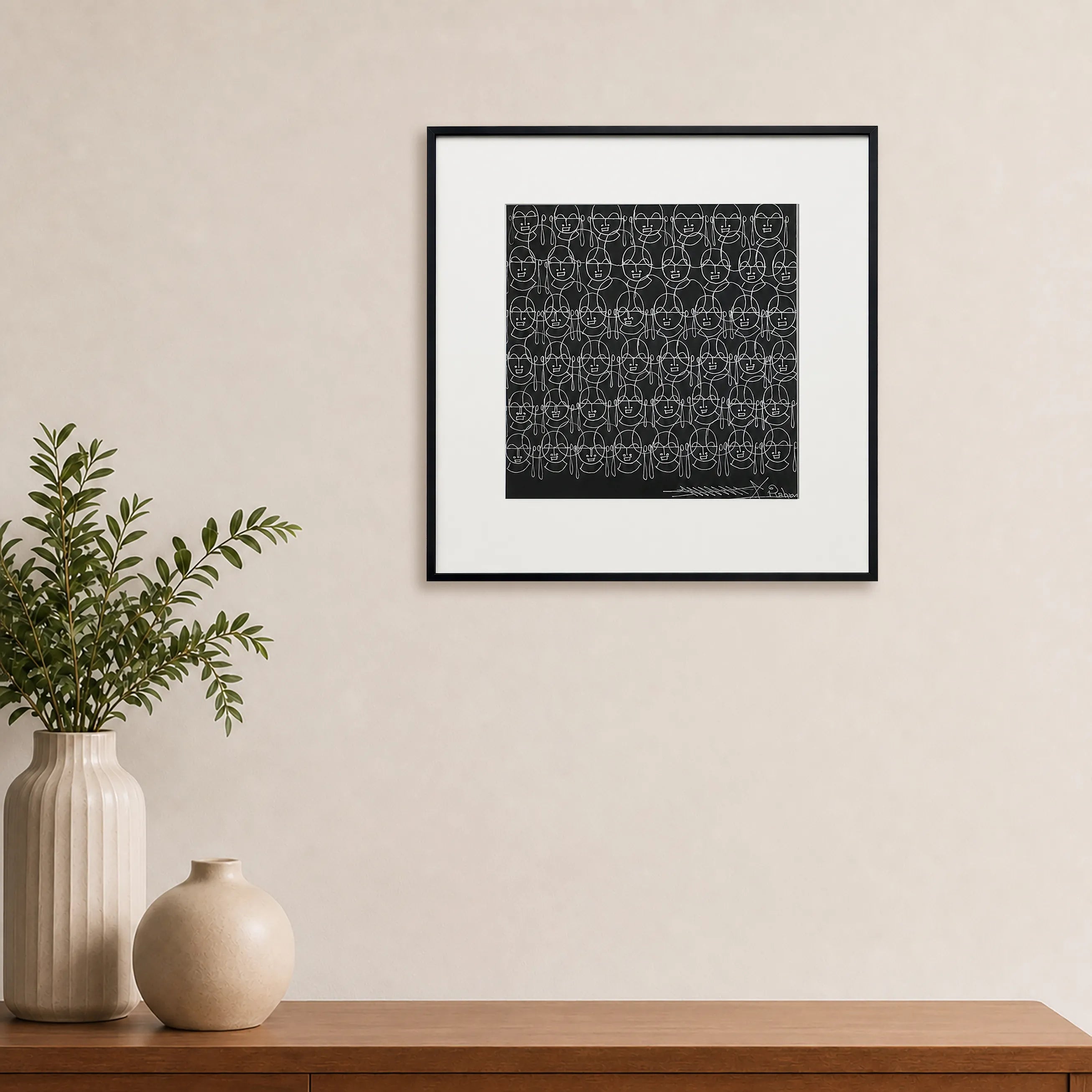 Framed Human Faces Surpur art painting hanging above a console table on a wall

