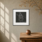 Framed Krishna Surpur art painting hanging above a console table on a wall

