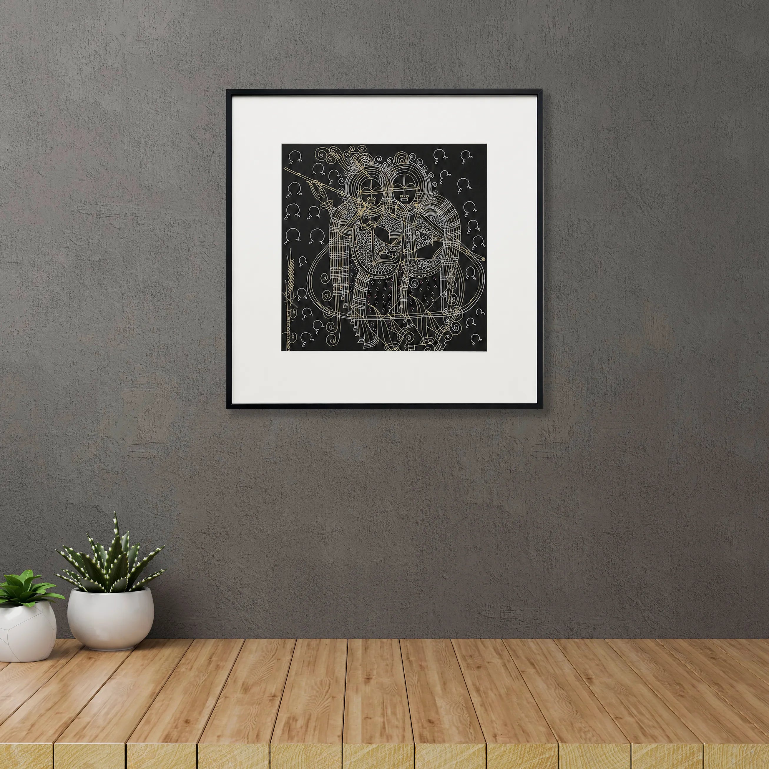Framed Radha-Krishna Surpur art painting hanging above a console table on a wall

