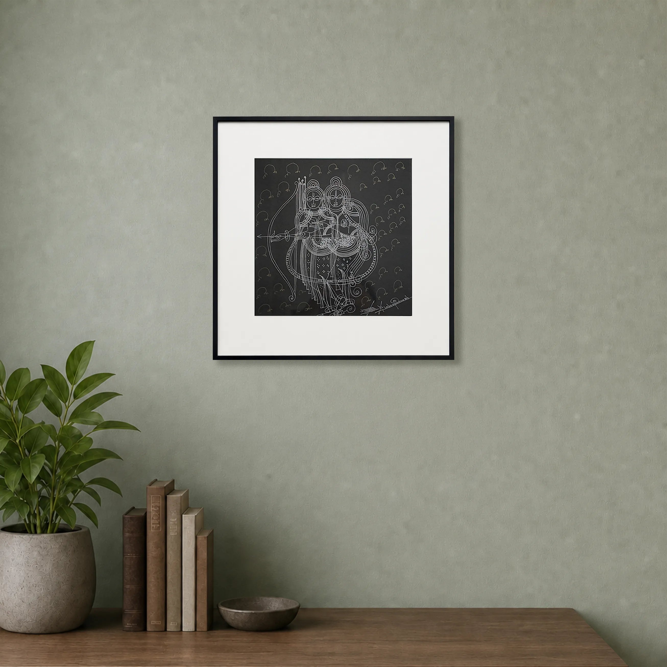 Framed Ram-Seeta Surpur art painting hanging above a console table on a wall