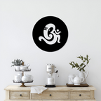Om Ganesha metal wall art round black decor on beige wall – modern spiritual home decor