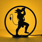 Hanuman Table Lamp glowing warm LED light on table, front view