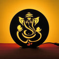 Lord Ganesh Table Lamp glowing warm LED light on table, front view