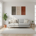 MDF wall art set of 3 panels above sofa in bright living room