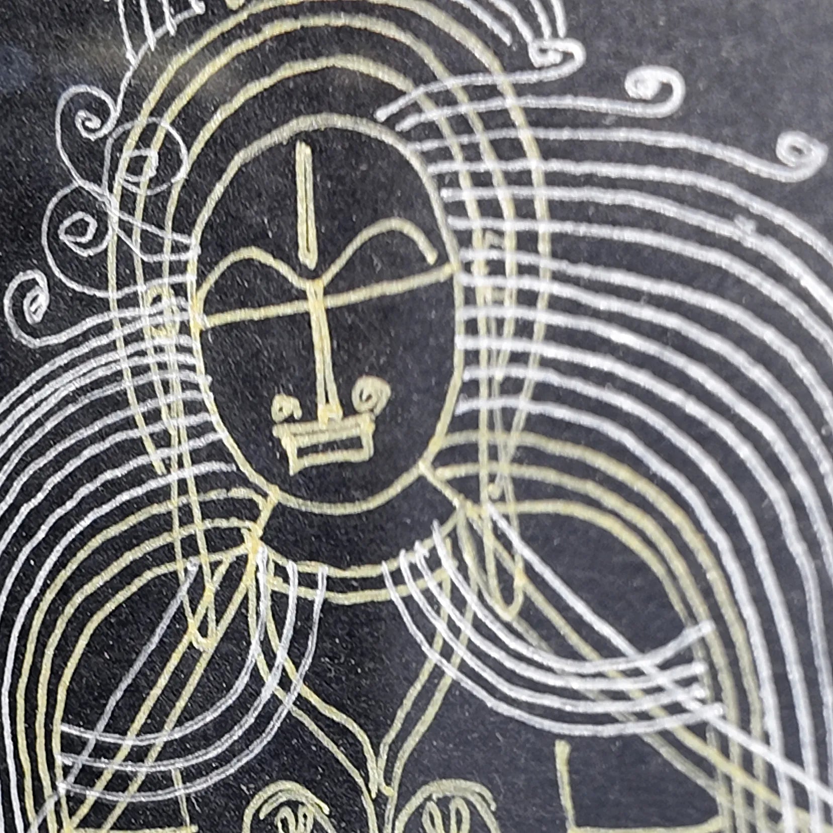 Macro shot of intricate hand-drawn ink linework on Goddess Laxmi artwork
