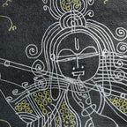 Macro shot of intricate hand-drawn ink linework on Krishna artwork
