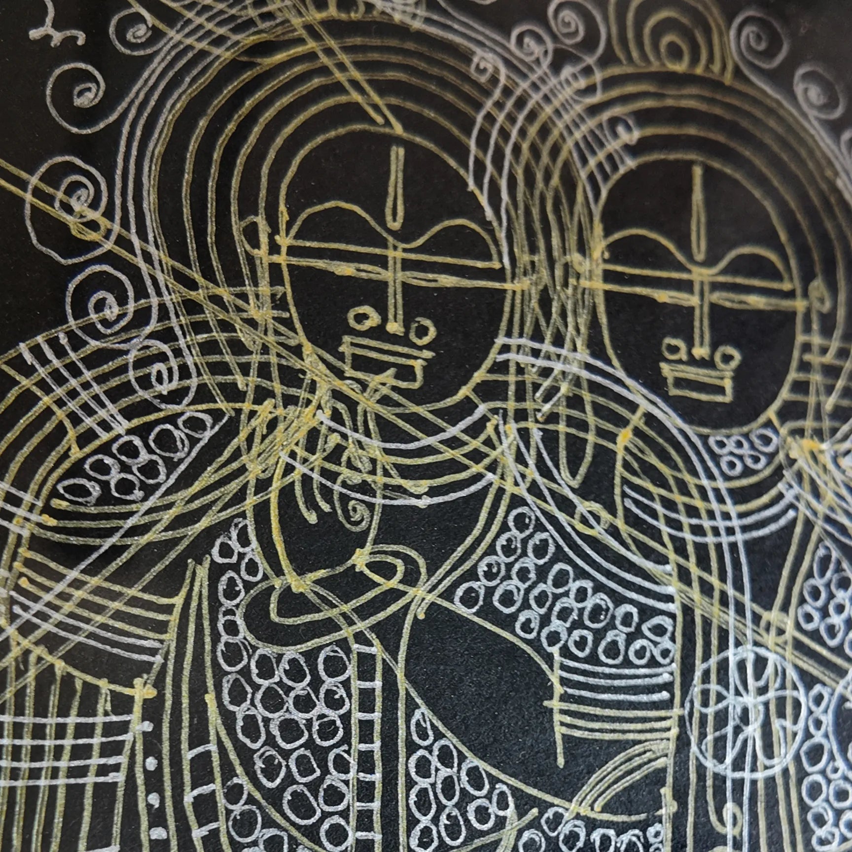 Macro shot of intricate hand-drawn ink linework on Radha-Krishna artwork
