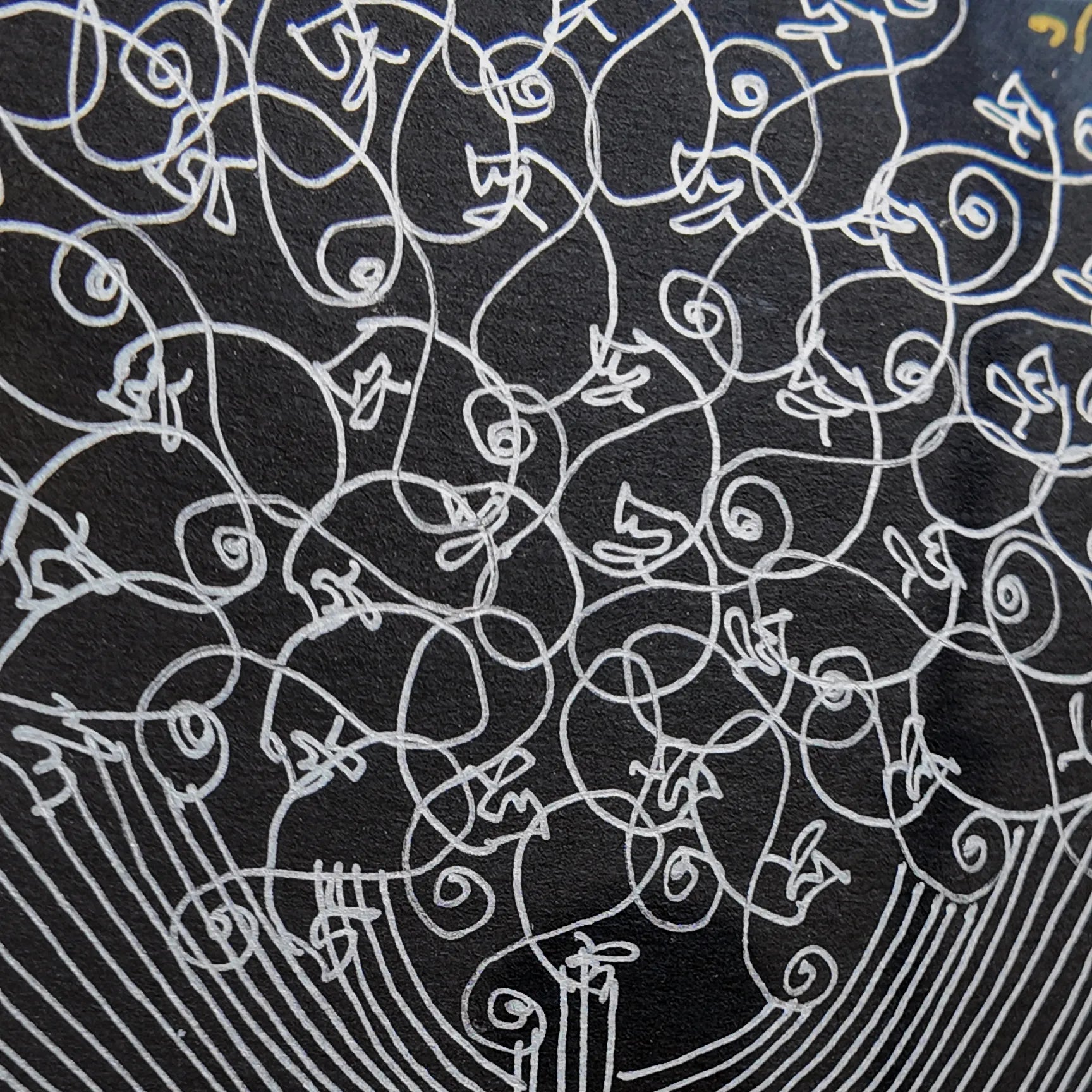 Macro shot of intricate hand-drawn ink linework on Tree of Life artwork
