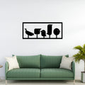 Matte black metal bird wall art in rectangular frame displayed above sofa