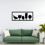 Matte black metal bird wall art in rectangular frame displayed above sofa