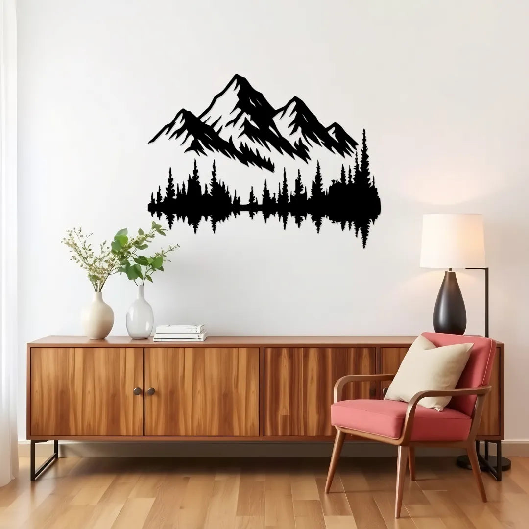 Mountain forest metal wall art above wooden cabinet and chair