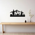 Mountain wildlife metal wall art above console table