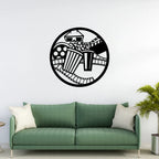 Movie theme metal wall art with popcorn and film strip above green sofa