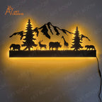 Nature-themed metal wall art featuring illuminated wildlife and mountains in matte black, enhancing decor.