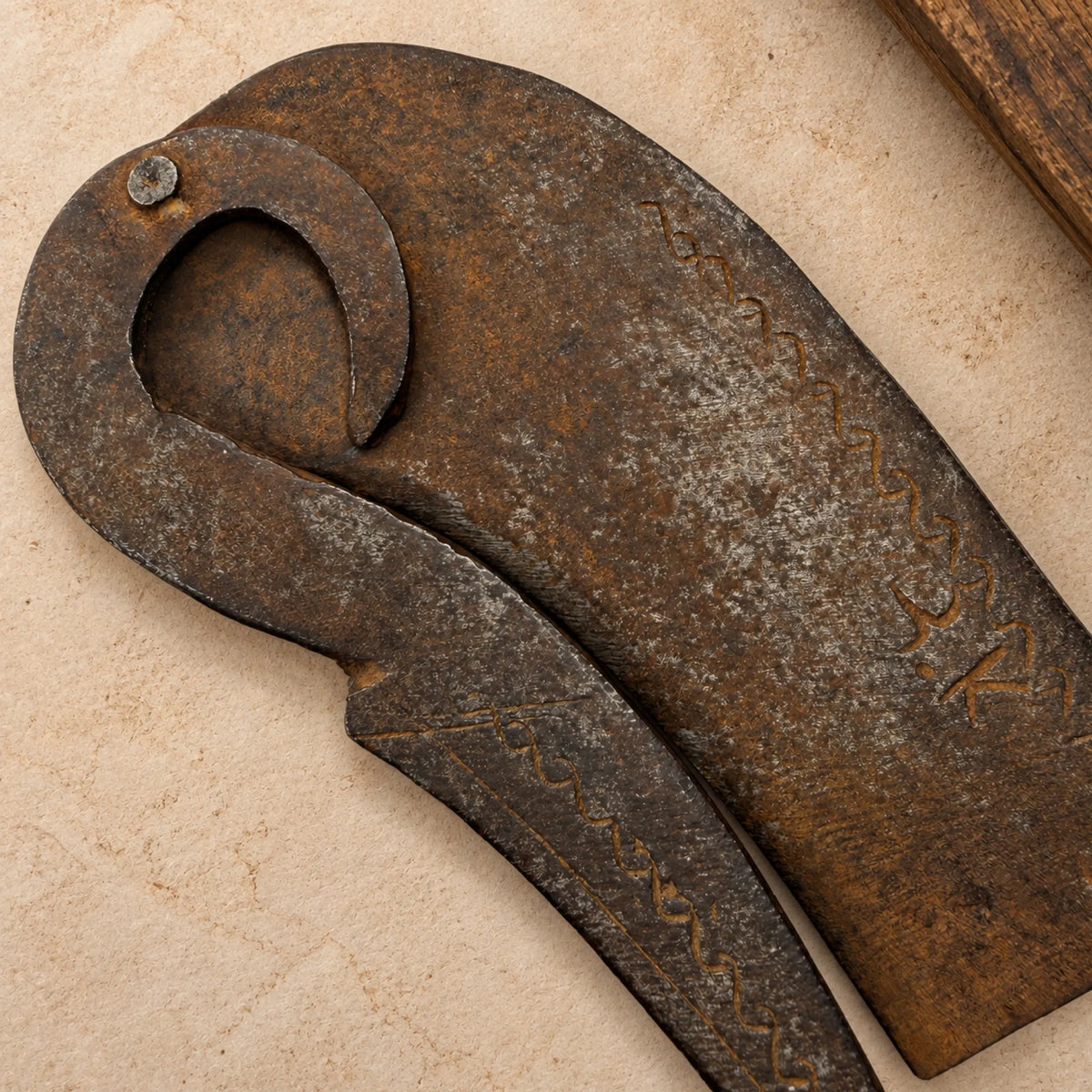 Antique Hand-Forged Iron Nutcracker with Engraved Border