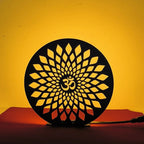 Om Table Lamp glowing warm LED light on table, front view