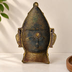 Rear view of the antique brass Gauri devi face mask
