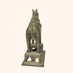 Rear view of the antique brass horse statue showing tail and harness detail
