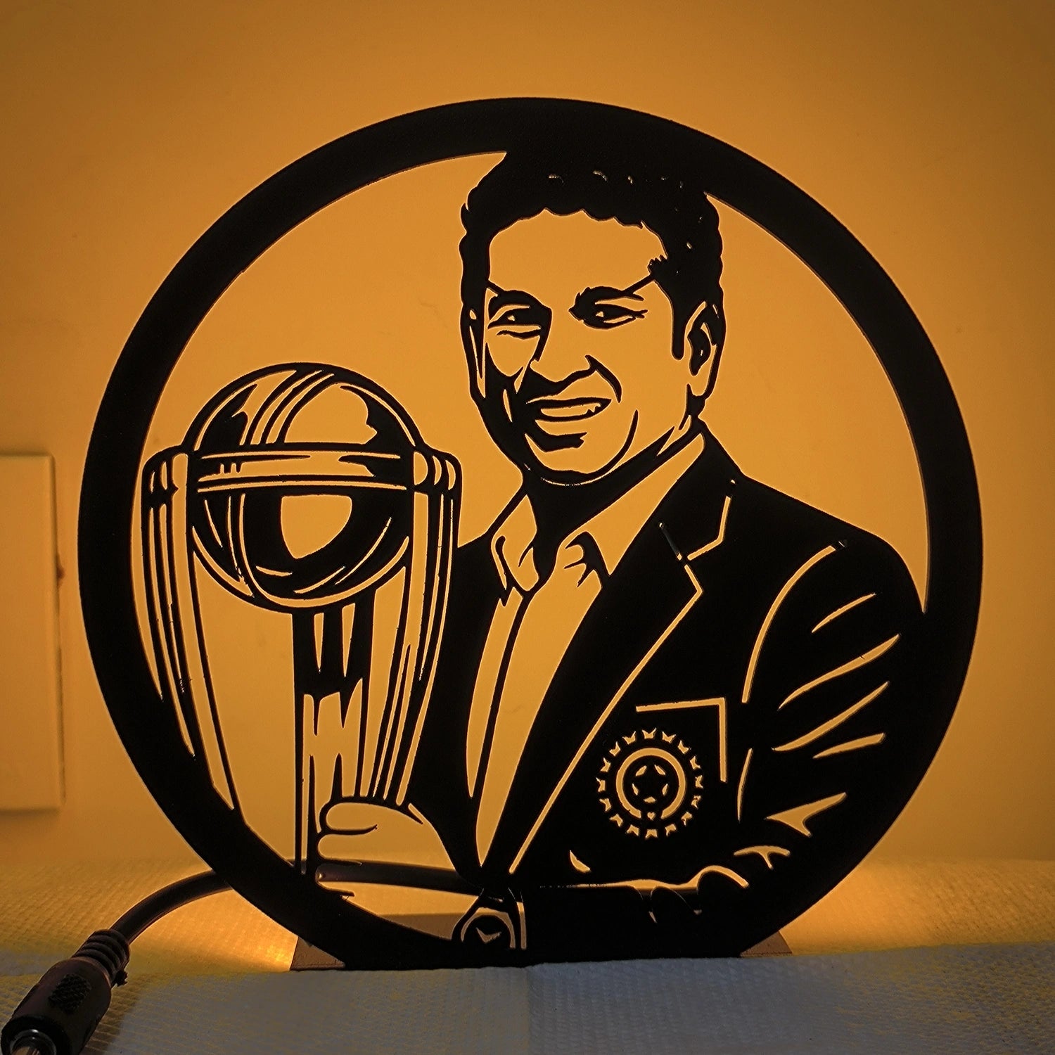 Sachin Tendulkar Table Lamp glowing warm LED light on table, front view