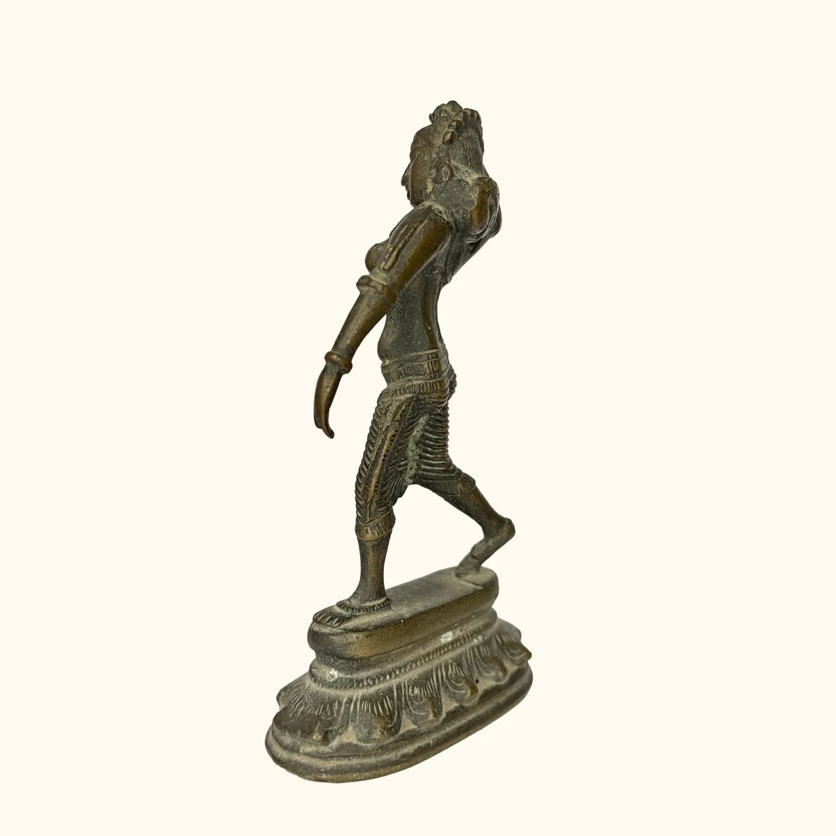 Side profile of the antique brass apsara statue showing the dance posture2