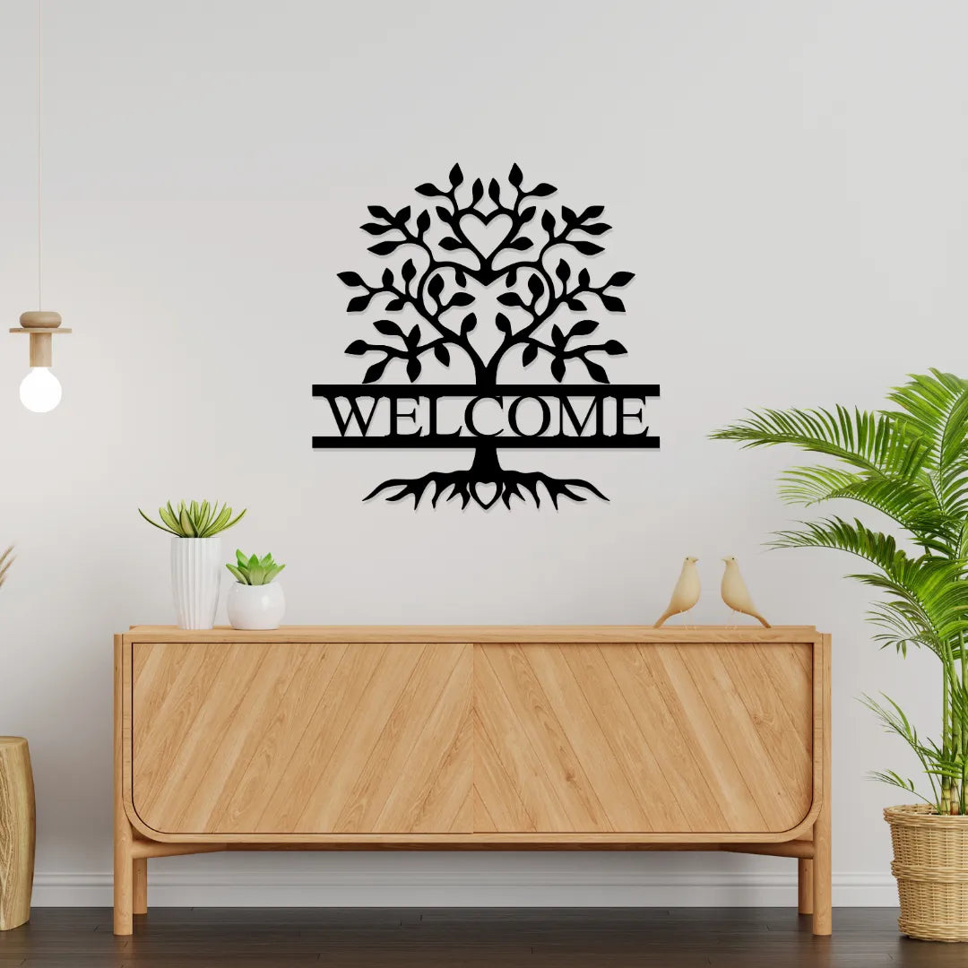 Welcome tree metal wall art above wooden sideboard