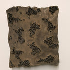 Rustic Indian wooden printing block with hand-carved abstract foliage and wave-like pattern