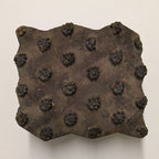 Antique Indian wooden printing block with hand-carved clustered floral dot motif, rustic patina