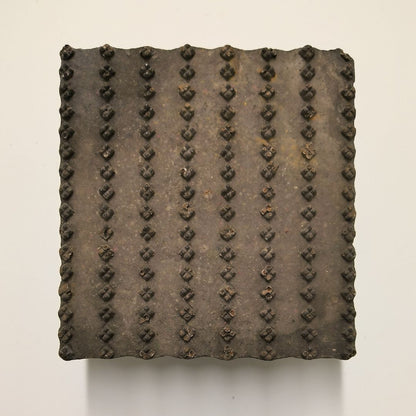 Indian wooden textile printing block with hand-carved linear dotted design