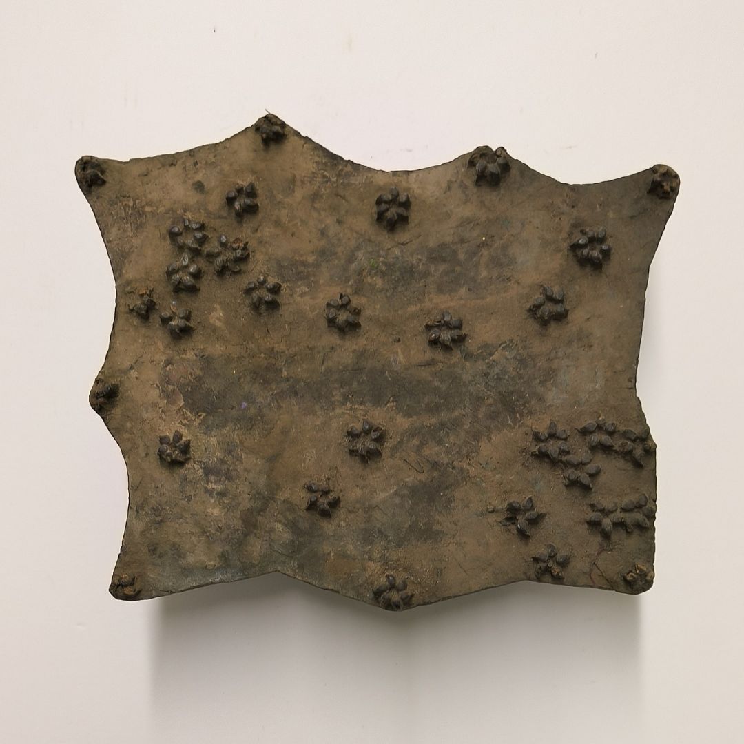 Vintage Indian wooden block featuring scattered small flower clusters carved into aged wood