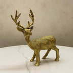 Three-quarter view of a handcrafted brass stag figurine, highlighting its proud posture and detailed craftsmanship