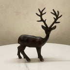Detailed brass deer statue with antlers
