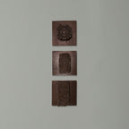 Vintage Indian wooden printing blocks displayed as rustic wall décor
