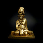 Samarth Murti brass idol front view on dark background