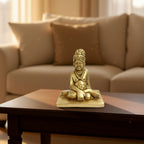 Brass Swami Samarth Murti idol placed on wooden table for home decor