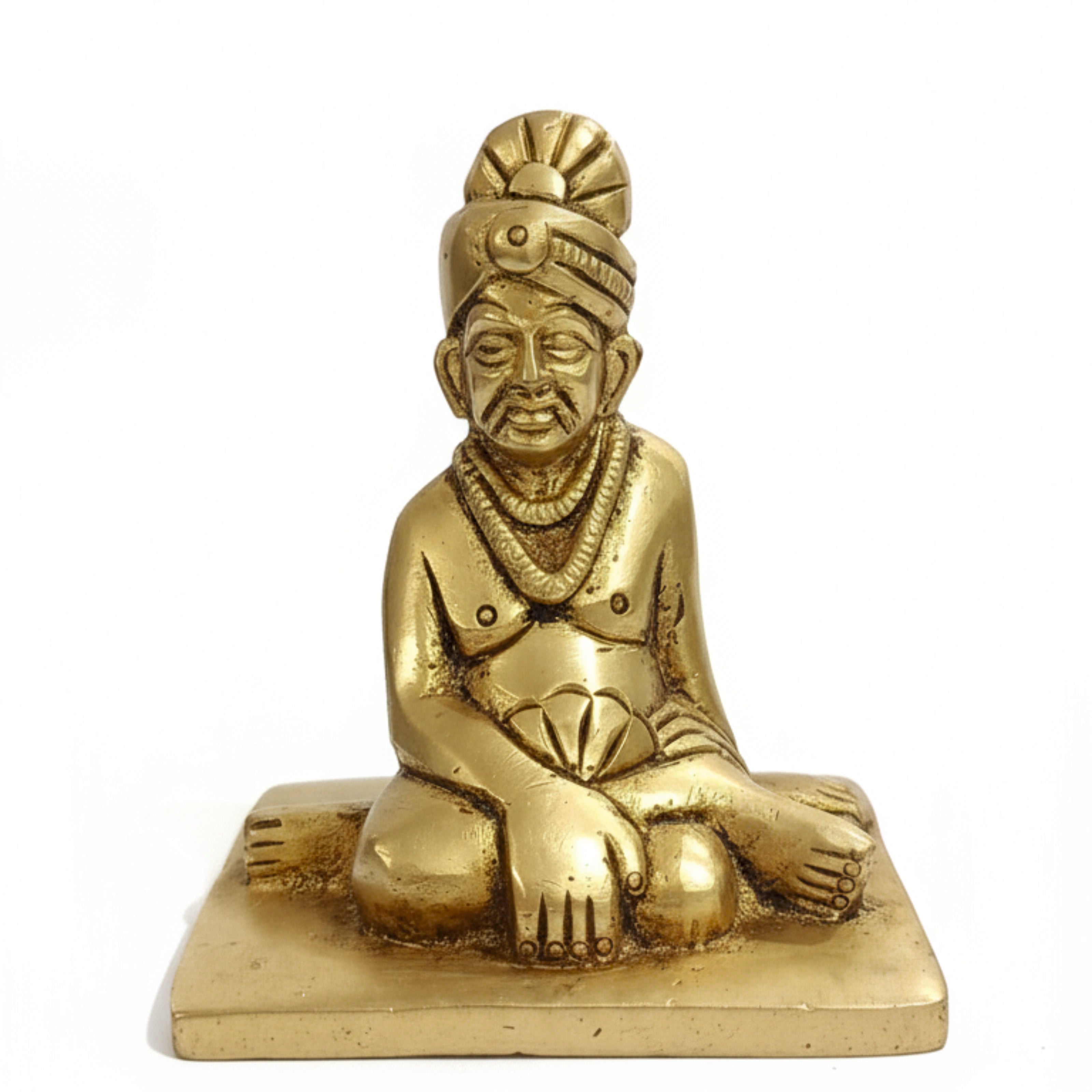 Golden brass Swami Samarth Murti idol isolated on white background